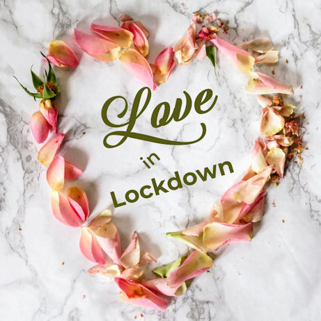 The words Love in Lockdown surrounded by
rose petals in the shape of a heart