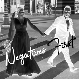 Negative image of bride and groom on zebra
crossing