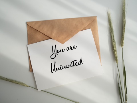 Envelope and card
reading You are un-invited
